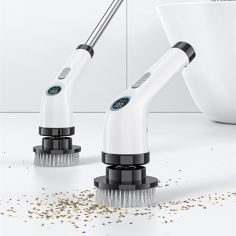 Cordless electric spin scrubber with extension handle cleaning a bathroom floor